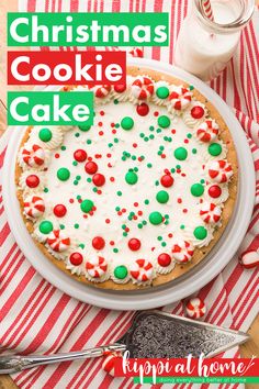 a christmas cookie cake with white frosting and green sprinkles