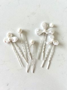 Sample Hair Pin Set - Only one set available These baroque style pearl hair pins feature simulated pearls strung on five silver hair pins. The perfect set of hair pins for your wedding day. Sold as a set of five. Dimensions: Each hairpin is 3.75" tall and 2" wide. Each order is thoughtfully gift wrapped and shipped in a gold embossed Luna + Stone branded keepsake box. These boxes are perfect for gifting and storing your accessories long after your big day. RUSH ORDERS AVAILABLE! PLEASE CONTACT U Pearl Hair Pin, Blue Wedding Hair, Pearl Bridal Headpiece, Wedding Hairpiece, Silver Hair Pin, Pearl Hair Pins, Pearl Bridal, Wedding Hair Pins, Baroque Style