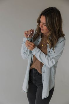 Introducing our Vintage-Inspired Heritage Denim Shirt Jacket for women. The perfect addition to your wardrobe for any season, AND to match with your littles. With its snap closures and scoop hem bottom, this jacket brings a touch of classic style to any outfit. Crafted from high-quality and light weight denim material, this shirt jacket boasts a timeless look that's both durable and comfortable to wear. The vintage-inspired wash gives it a unique character that sets it apart from your standard s Hanna Marin Rosewood Jacket Denim, Light Blue Denim Shirt Women Outfit Ideas, Cute Wrangler Outfits, Jeans And Hat Outfit Baseball Caps, Black Denim Shacket Outfit, Jean Shirt With Jeans Outfit, Womens Denim Shirt Outfit, Denim Shirt Jacket Outfit Women, Denim Shirt Outfits For Women