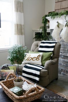 a living room filled with furniture and christmas decorations