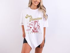 Fun and funky retro style football tee, perfect for tailgating and cheering on your favorite team! Features 70s style characters for a cute and fun look. SIZE AND FIT  These Comfort Colors® shirts are soft, high-quality, unisex t-shirts with a unique vintage, worn-in aesthetic. These shirts are true to size, so if you prefer an oversized look - size up. For a more fitted look - size down. If you are going for the 'shirt dress' look, I recommend going up two sizes. Please refer to the size chart Football Season Screen Print Tops For College, Screen Print Tops For Football Season, Screen Print Tops For College Football Season, Football Season Fan Gear Graphic Tee, Football Season Graphic Tee Fan Gear, Retro Sports Fan Merchandise Tops, Retro Fan Gear Tops For Sports Season, Retro Tops For Sports Season Fan Gear, Sporty White Tops With Funny Print