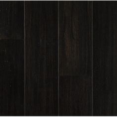 black wood flooring with dark stain on it