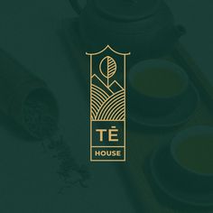 the tea house logo is shown on a dark green background with gold trimmings