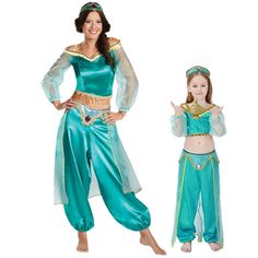 a woman in a blue costume is posing for the camera with her hands on her hips