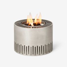 a small metal fire pit with three flames