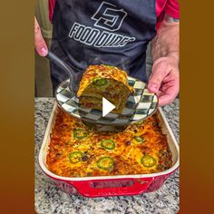 a person in an apron scooping food out of a casserole dish