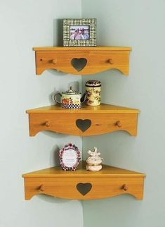 three wooden shelves with hearts on them