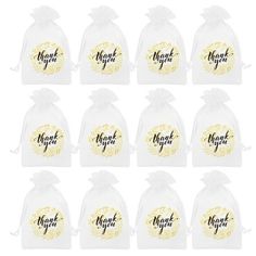 twelve clear bags with thank you written on the front and bottom, in gold foil