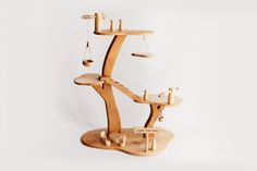 a wooden balance scale sitting on top of a table