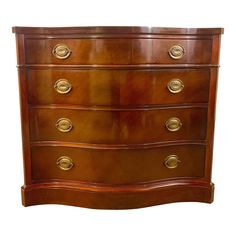 an antique chest of drawers with brass pulls and knobs on the top, against a white background