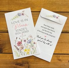 two wedding cards with flowers on them and the words love is in heaven written below