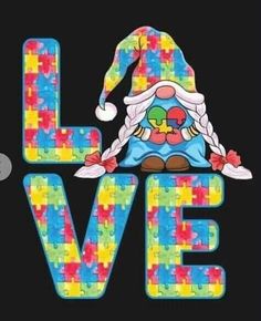 the word love is made up of colorful puzzle pieces and a santa hat on top