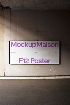 there is a sign on the wall that says mock up madison f2 poster in front of it