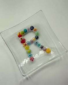 a glass plate with some beads on it