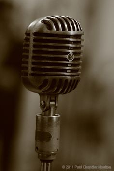 an old fashioned microphone is shown in black and white