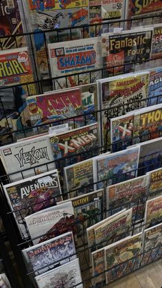 many comics are stacked up on the floor