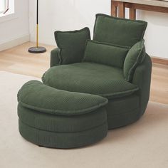 a green chair and ottoman in a room