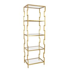 a gold metal shelf with glass shelves