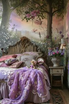 a bedroom decorated in purple and pink with flowers on the wall