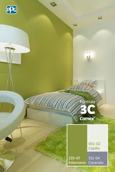 a bedroom with green walls and white furniture