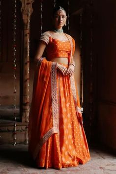 Orange lehenga with bloom print and lace embellished panel. Paired with dori, sequin, zardozi embroidered blouse and dupatta. - Aza Fashions Orange Lehenga, Zardosi Embroidery, Dupion Silk, Cape Sleeves, Silk Lehenga, Sweetheart Neck, Embroidered Blouse, Set For Women, Aza Fashion