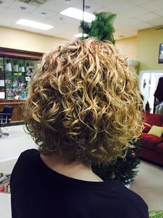 very nice medium length permed style with loose curl