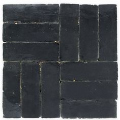 black slate tiles stacked on top of each other, with one block in the middle