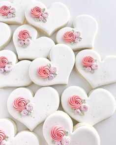 heart shaped cookies decorated with pink and white icing