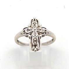 * Designer Ashi 925 Sterling Silver Round Diamond Cross Ring * Ring Size: 7 * Band Width: 1.75 * Top Of Ring Measures: 5/8" X 1/2" * Height: 1/8" * Weight: 2.5 Tgw * 11 Round Diamonds Measure Approximately 0.9 Mm To 0.8 Mm * Ring Can Be Resized For An Additional Fee. * Marked: Ashi * 925 * S * 1/20 * Condition: As Pictured. * S6138 Elegant Cross Rings With Diamond Accents, Elegant Cross Ring For Anniversary, Sterling Silver Cross Fine Jewelry, Fine Jewelry Sterling Silver Cross, Diamond Cross Ring For Gift, Diamond Cross Rings For Gifts, Cross-shaped Diamond Ring For Gift, White Sterling Silver Diamond Ring With Polished Finish, Elegant Cross-shaped White Gold Ring