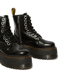 It's landed. Dr Martens highest platform to date. The Quad Max sole stands at a towering 2.2 inches: built to make wearers feel on top of the world. A full-volume update of our smash-hit Jadon silhouette, these platform boots are kitted out with oversized eyelets and laces with metal aglets. The uncompromising boots also have a medial zip for functionality, standout giraffe laces (and a spare set of black ones) and all our usual DNA. Buttero is a full-grain, smooth leather, with a satin gloss an Chunky Chelsea Circus Boots, Platform Boots Miggon 🛍️, Dr Martens Jadon Smooth Leather Platform Boots, Patent Jadon Boots, Doc Martens Platform Boots Mens, Jadon Max Platform Boot, Dr Martens Jadon Max, Jadon Max, Jadon Platform Boots