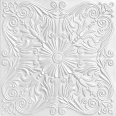 a white ceiling tile with an intricate design