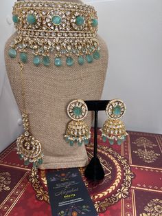 This Gorgeous Sabyasachi inspired with Moissanite Necklace with matching earrings. Comprises of Fine Oversized Uncut Kundan polki stones This necklace is flexible and takes the shape of the neck. Fine quality and craftsmanship. Perfect for desi weddings. Necklace comes in drawstring cord therefore adjustable Earrings length: Approx 2.5 inches Red Stone Necklace, Sabyasachi Jewelry, Indian Choker, Sabyasachi Jewellery, Kundan Choker, Moissanite Necklace, Desi Wedding, Jewelry Indian, Wedding Jewellery Necklace