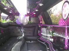 the interior of a party bus with balloons and decorations