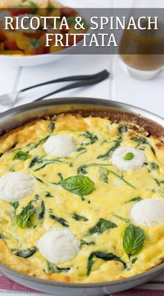 a quiche with spinach and mozzarella in a pan on a table