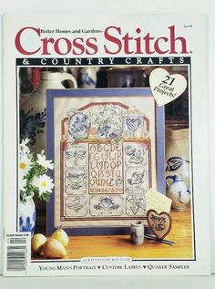 the cross stitch and country crafts magazine is on display