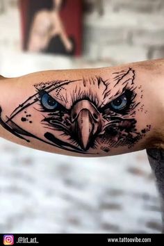 an eagle with blue eyes on the arm