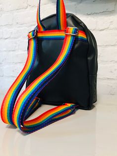 This small but roomy backpack is made from recycled punctured inner tubes and lorry curtain off cuts.  It is single skin, has a fully zipped front pocket, a top entry half zip and an internal slip pocket.  The straps and hanging loop are made from rainbow nylon webbing but it could also be made with plain black, sage/army green or purple webbing.  It measures approximately 26x22x7cms.  All the inner tubes have been cleaned using SFV eco cruelty free cleaner. Some of the inner tubes may have factory branding and or puncture patches on them making each one unique.  Any questions then please ask. Rachel.  ♻️💚♻️💚♻️ Everyday Rainbow Backpack, Rainbow Backpack, Christian Products, Black Sage, Kidcore Aesthetic, Diy Backpack, Vegan Wallet, Festival Bag, Inner Tube