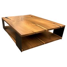 a wooden coffee table with two shelves on each side and one shelf below the top