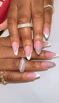 Oval French Tip Nails With Diamonds, Almond Nails French Tip With Gems, French Nails On Black Women, Black French Top With Gems, Almond Shape French Tip Design, Almond Shape Nails With Rhinestones, High Arch French Tip Nails, French Tip Nails With Righnstones