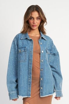 Make a statement in our Oversized Rhinestone Denim Shacket! This unique piece has all the comfort of an oversized shirt with the feel of a jacket, plus standout rhinestone detailing make it truly one-of-a-kind. Rock it and sparkle on your next night out! Oversized Denim Blue Jacket With Button Closure, Luxury Oversized Denim Blue Denim Jacket, Denim Oversized Jacket, Oversized Button-up Denim Blue Outerwear, Oversized Denim Button-up Jacket With Snap Buttons, Rhinestone Denim Jacket, Luxury Oversized Button-up Denim Jacket, Rhinestone Denim, Denim Shacket