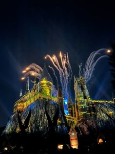 fireworks light up the night sky over hogwart's castle