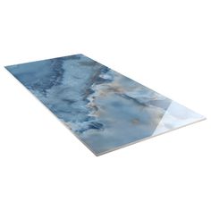 a blue and white marble table top with an abstract design in the middle, against a white background