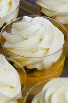 cupcakes with white frosting in small glass dishes