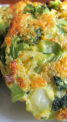 broccoli florets and cheese on a white plate