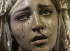 a woman with tears on her face and nose