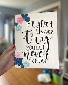 a hand holding up a card that says if you never try, you'll never know