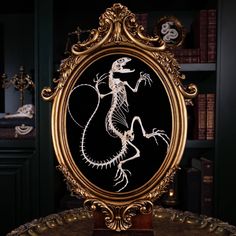 -This is Not a Dinosaur skeleton-  This art piece is made of a real Butterfly Agama skeleton posed in the shape of a Dinosaur skeleton fossil, resting on a Vintage Victorian picture frame.  The Skeleton dimension alone: 21 x 17 x 4 cm **What you see is what you get** The Skeleton is real, from real Butterfly Agama and ethically sourced.  All skulls and skeletons were processed by me and my team. Pictures were taken by me.  Every item was cleaned and articulated together by hand, it has unique nu Victorian Picture Frames, Pink Goth, Victorian Pictures, Monster Fishing, Dinosaur Skeleton, Real Butterfly, Skeleton Bones, Bone Art, Team Pictures