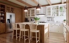 a kitchen with wooden floors and white cabinets