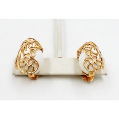 This is part of Chairish’s Costume Jewelry assortment.  1950s goldtone filigree and white resin clip back earrings. Marked on the base of the clips "Napier." Measure:  1.13 inches L x 0.75 inches W. Excellent condition.  Please reference the measurements noted in the description above for the best approximate dimensions. Please reach out to the seller under "Ask the Seller" for specific questions regarding the measurements. Formal White Clip-on Earrings, White Formal Clip-on Earrings, Vintage Filigree Clip-on Earrings For Formal Occasions, Vintage Filigree Clip-on Earrings For Formal Events, Vintage White Filigree Earrings, White Vintage Clip-on Earrings For Anniversary, Vintage White Clip-on Earrings For Anniversary, White Clip-on Earrings For Anniversary, White Vintage Clip-on Earrings For Formal Events