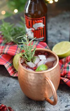 a copper mug filled with ice and garnish